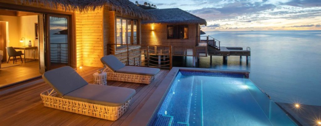 Deck and infinity pool attached to overwater bungalow at the Royalton Antigua
