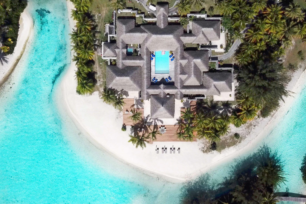 Overhead view of large suite of rooms and surrounding ocean and beach at the St. Regis Bora Bora