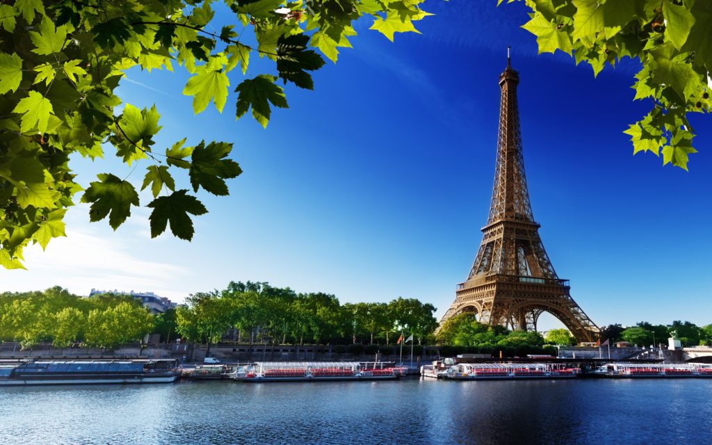 Eiffel tower from across a river in Paris, France