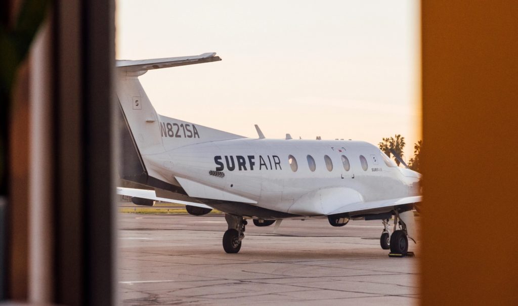 A SurfAir semi-private jet as seen through an opening in a door