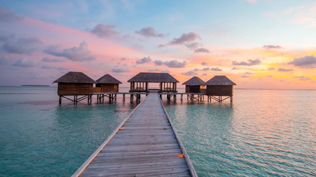 Wood plank path leading to the five building overwater spa at Conrad Maldives Rangali Island