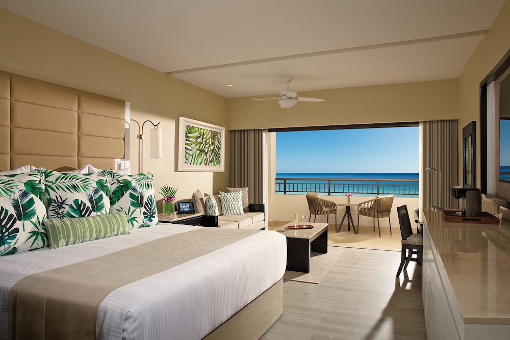 Room opening up onto a balcony with a view of the ocean at Secrets Wild Orchid Montego Bay Luxury Adults-Only All-Inclusive, Montego Bay, Jamaica
