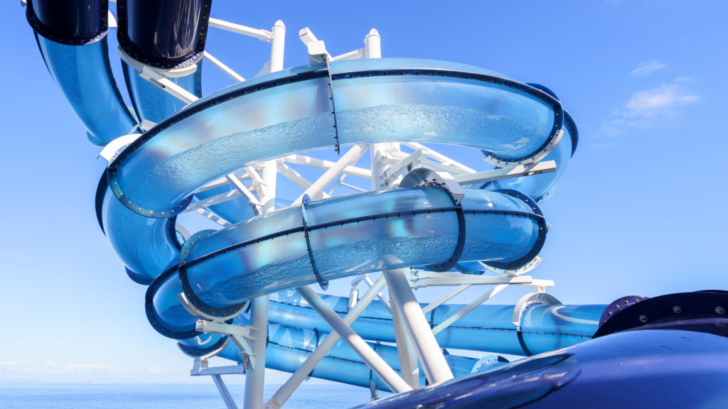 Clear tube water slide on a cruise ship with ocean in background