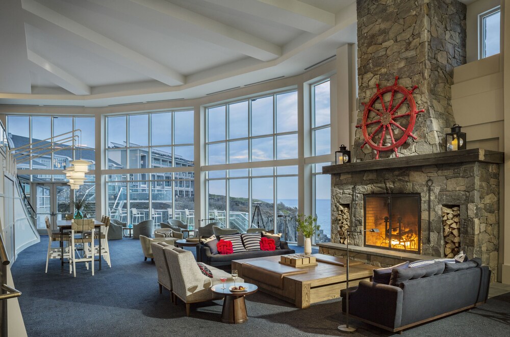 Sitting area by the fire at Cliff House Maine