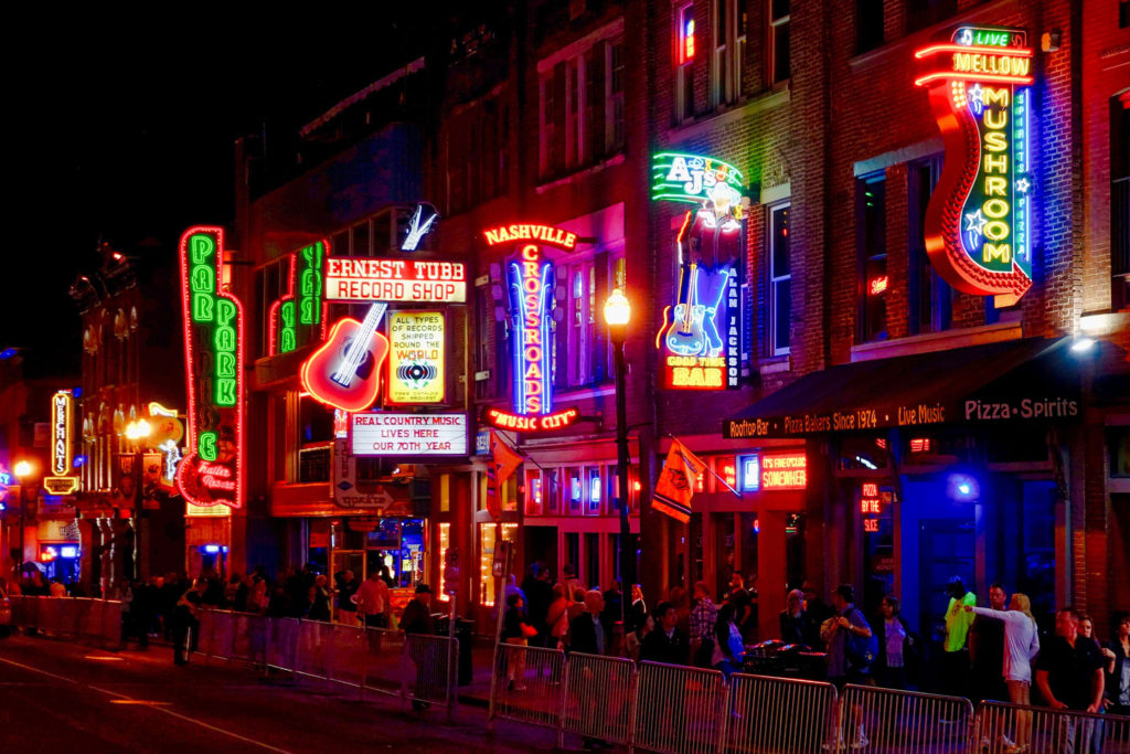 Lower Broadway in Nashville, Tennessee illuminated at night with neon signs