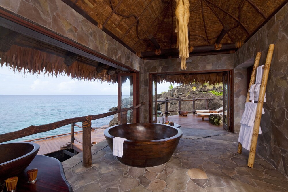 Outdoor bathing area on the deck of a bungalow at COMO Laucala 