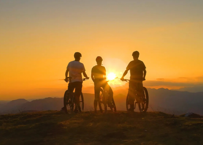 Silhouette of bikers at sunset