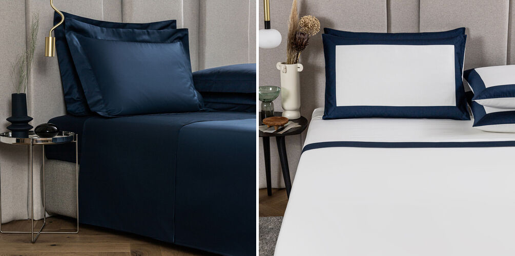 Bed made up with dark blue Frette sheets (left) and bed made up with white and navy Frette sheets (right)