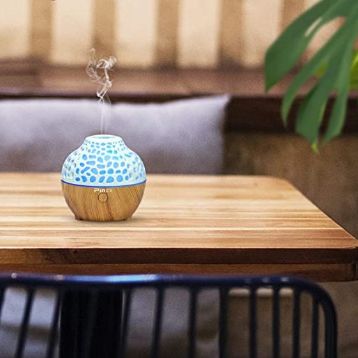 The Picni Essential Oil Diffuser on a wooden table