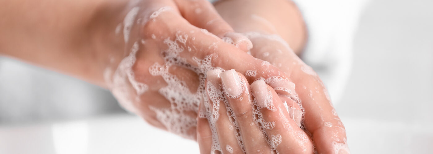 Close up of person washing hands