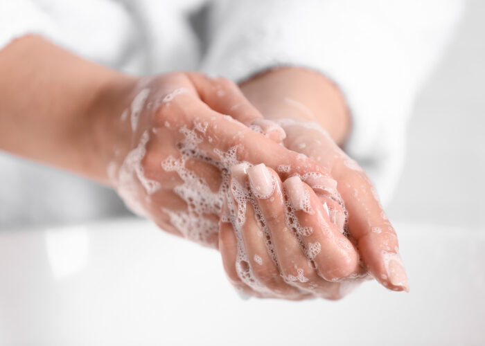 Close up of person washing hands