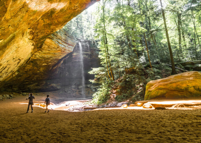 Two kids playing in Ash Cave in Hocking Hills State Park