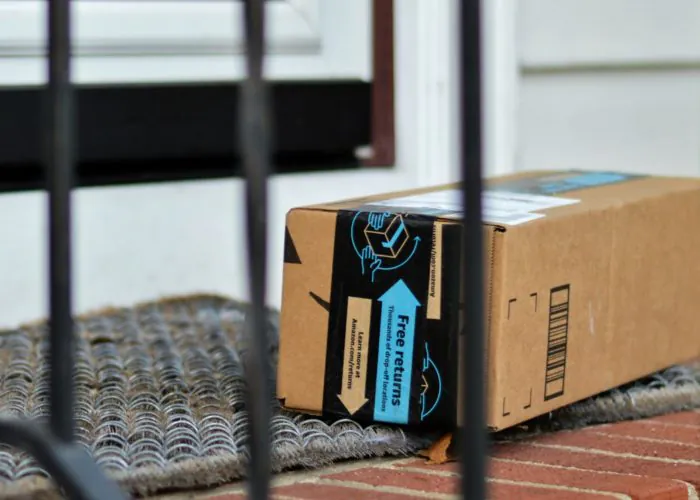 Amazon box on front porch of house